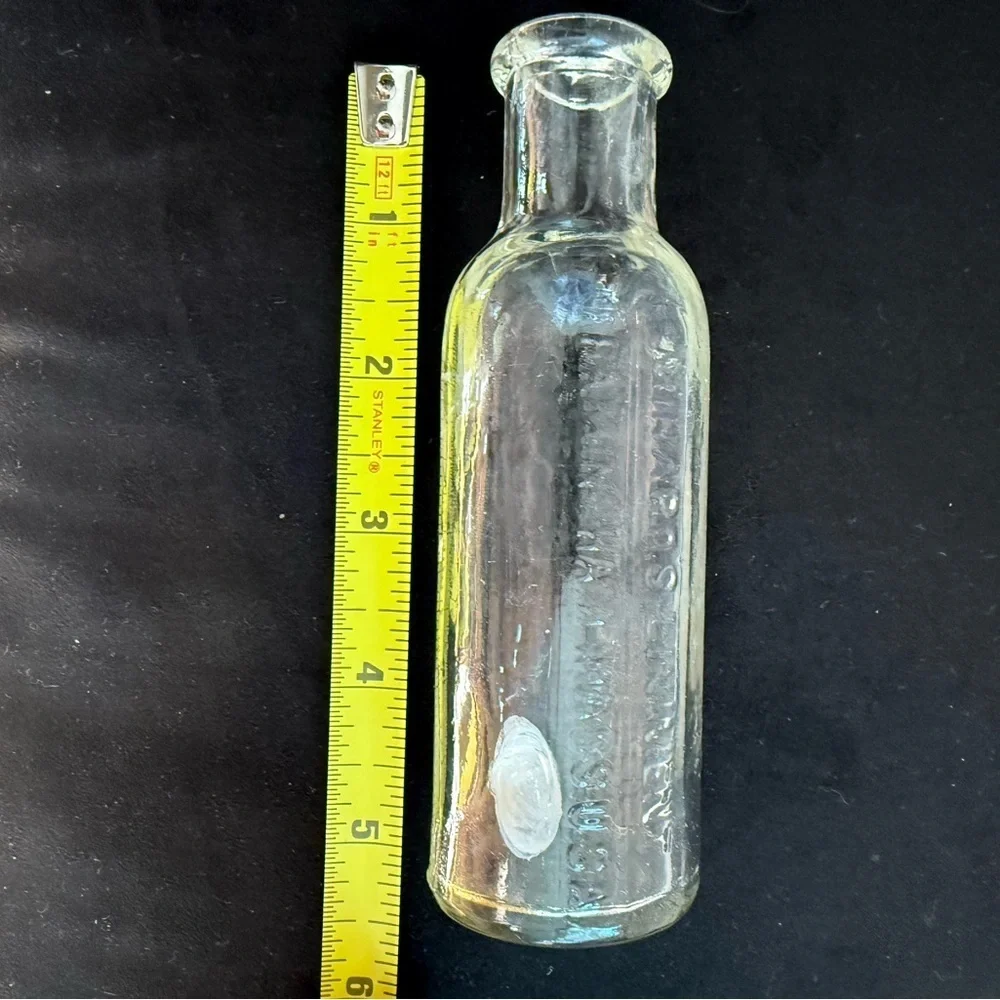 Minnard’s Linniment Embossed Glass Bottle 5 inches ANTIQUE